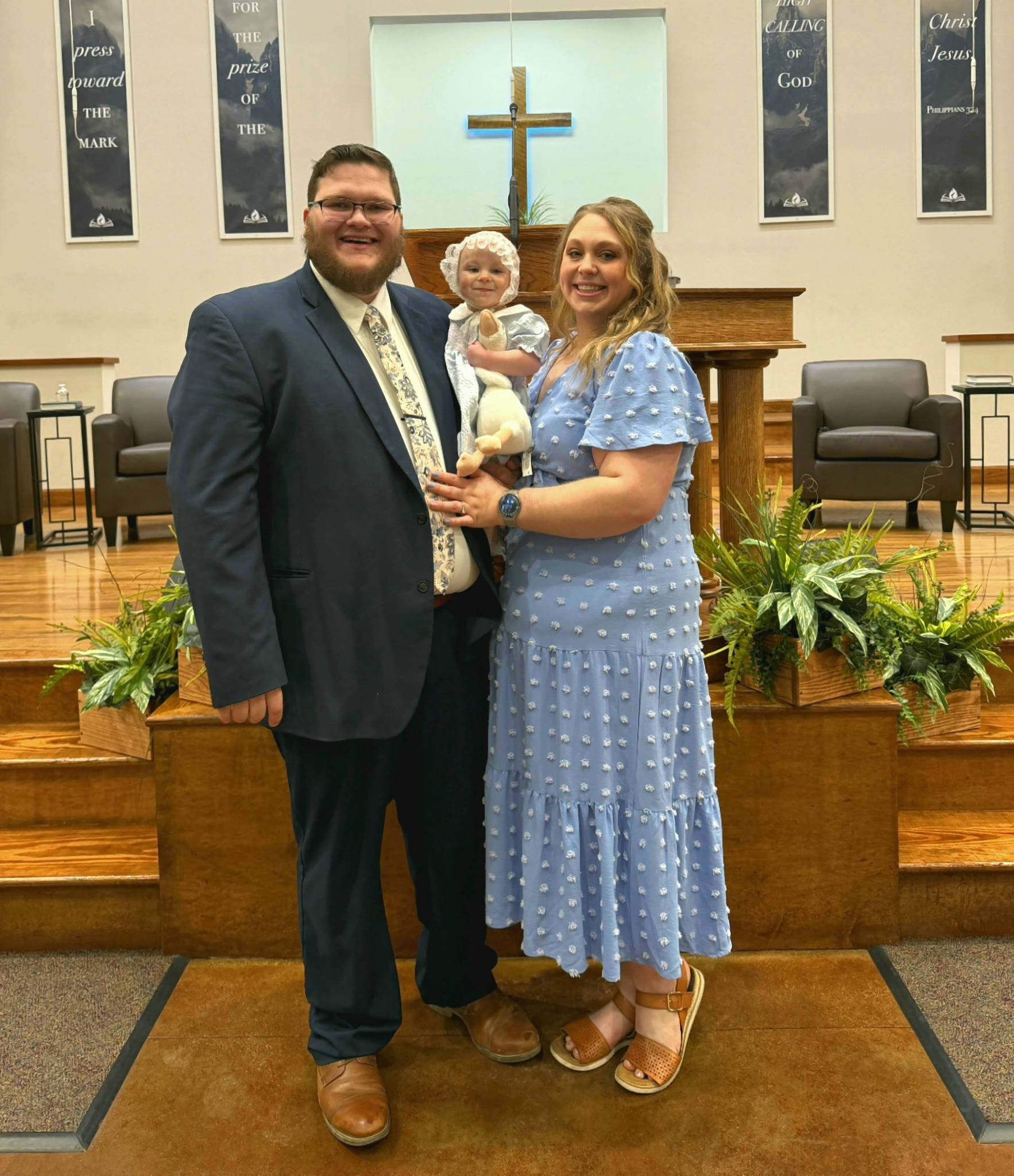 The baker pictured with her husband and their daughter at church on a special day